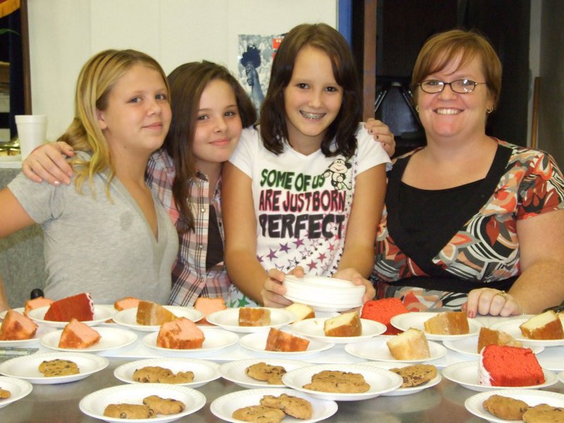 Image: Lots of deserts — Alyssa Sprabary, Brittany Scamahorn, Stormy Bennett and Tonya Krnavek, Junior High cheerleaders and their sponsor — Tonya Krnavek.