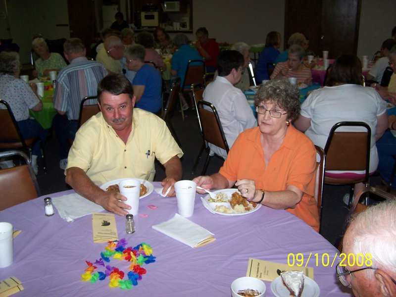 Image: Eubank and Lawson eating — Larry Eubank, school board president and Diane Lawson, retired school administrator.