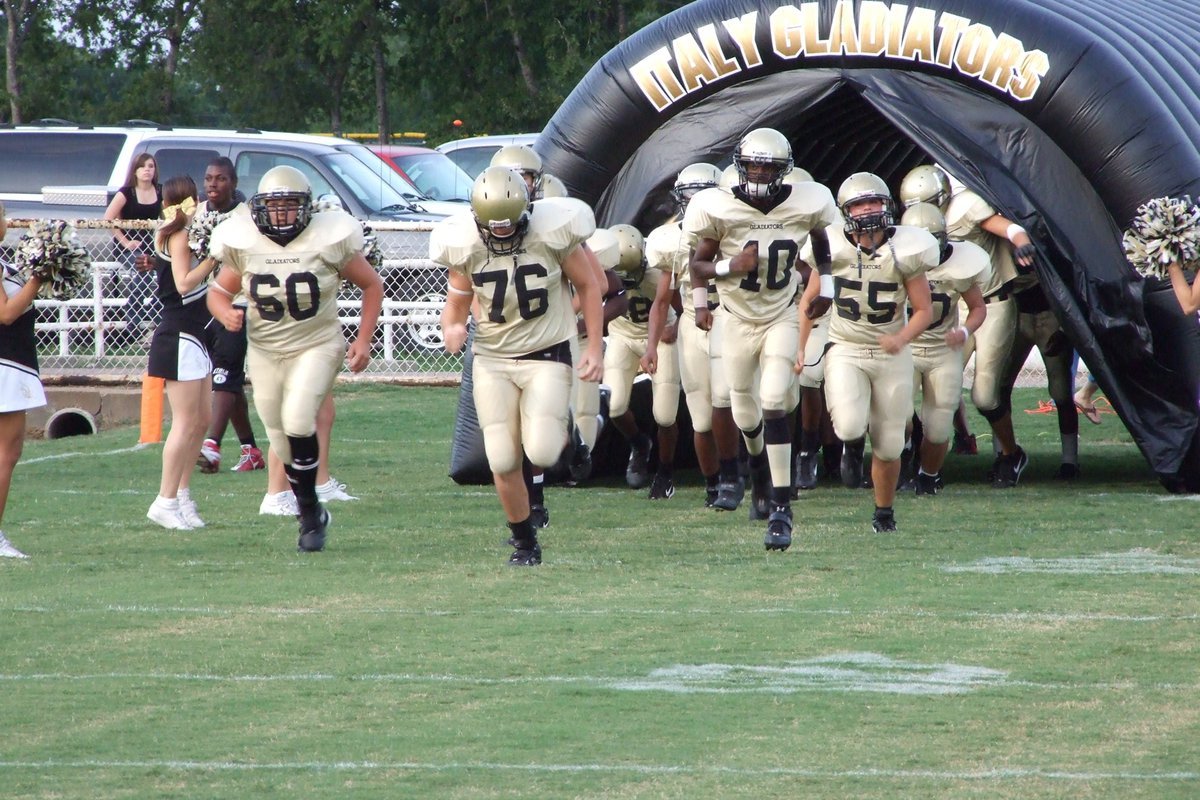 Image: Palmer vs Italy — The Gladiators run to the field.