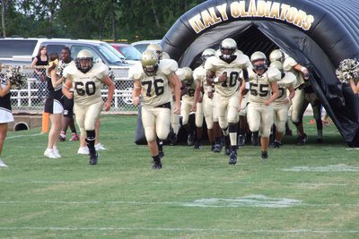 Image: Palmer vs Italy — The Gladiators run to the field.