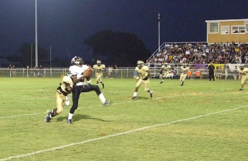 Image: Palmer vs Italy — Block to the back might bring him down.