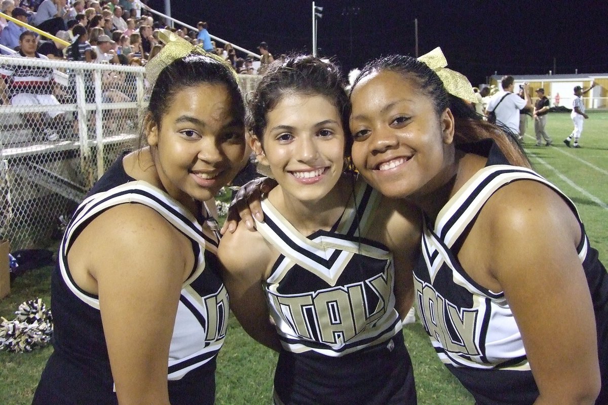 Image: Palmer vs Italy — Cheerleaders Destani Anderson, Beverly Barnhart and Amber Mitchell huddle up for a photo.