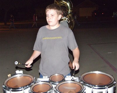 Image: Brett bangs away — Brett Kirton rattled the neighborhood roadways during rehearsal.