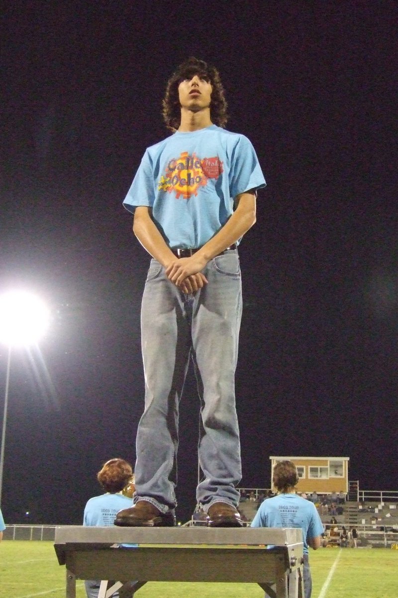 Image: Introducing Chase Michaels — Drum major, Chase Michaels, is introduced to the halftime crowd.