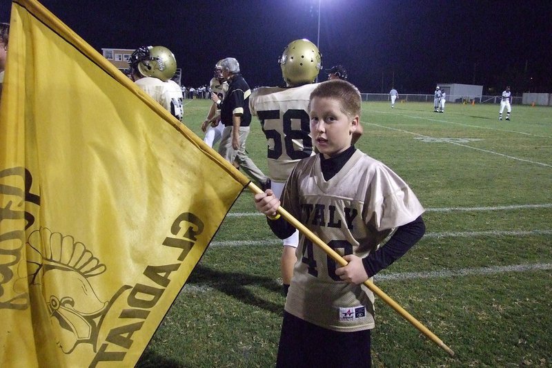 Image: Escamilla holds flag — John Escamillia holds the Gladiator flag.