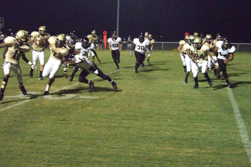 Image: Jasenio gets by — Jasenio Anderson squeezes by the defense.