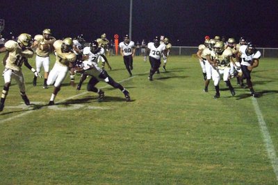 Image: Jasenio gets by — Jasenio Anderson squeezes by the defense.