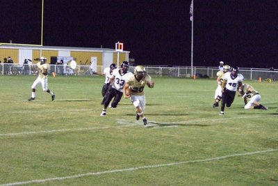 Image: Major runs — Clay Major runs for yardage gain.