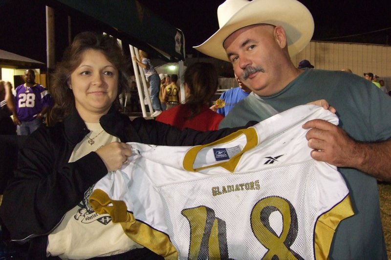 Image: Vintage jersey award — Flossie Gowin awards Donald Brummett the vintage jersey from the Italy Athletic Booster Club.