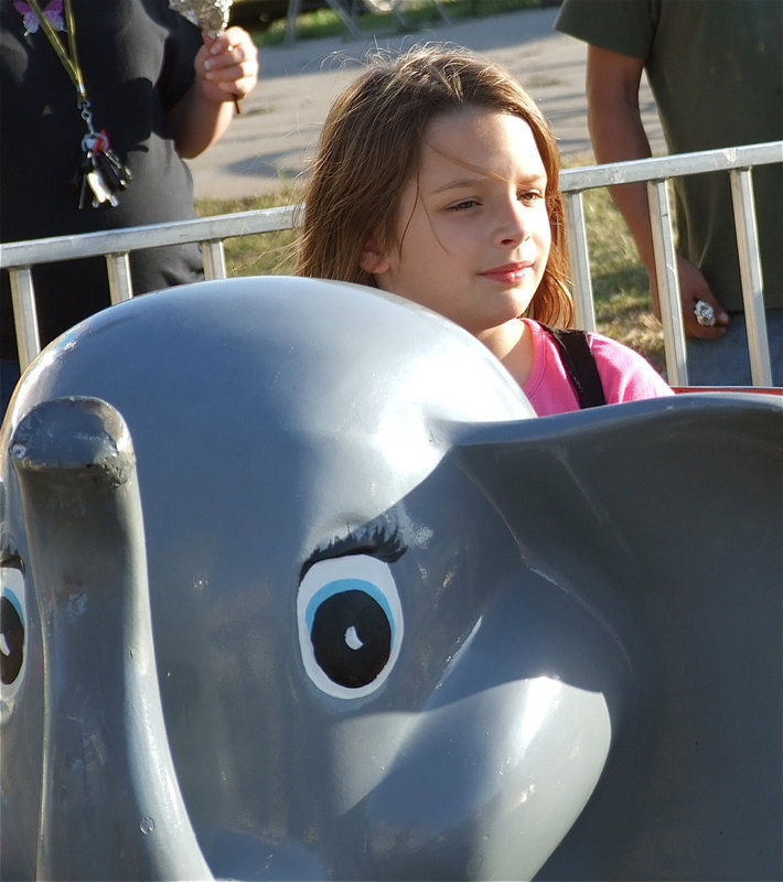 Image: Evie Hernandez takes her turn on the elephant ride.