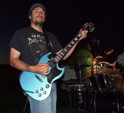 Image: Steven Galvan helps entertain guests on Friday night as a member of the, “Justin Guthrie Band.”