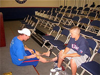 Image: Josh Hamilton, of the Texas Rangers baseball organization, signs a bat for Kolton Smith while the two were visiting during Kolton’s treatment for leukemia.