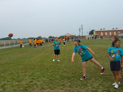 Image: This fifth grader had a good throw for the foot ball throw event.