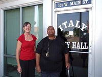 Image: City Administrator, Teri Murdock, stands with Mayor, Frank Jackson, in front of Italy City Hall after the Mayor proclaims the month of May, “Motorcycle Safety and Awareness Month,” in the city of Italy.