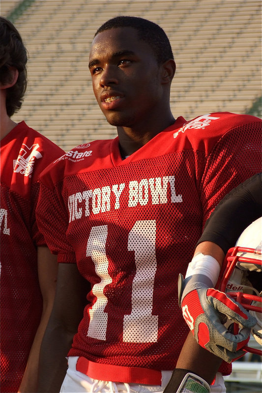 Image: Being announced at halftime of the 2011 FCA Victory Bowl is Jasenio Anderson(11) along with his Red Teammates and coaches.