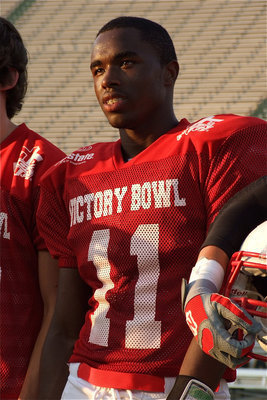 Image: Being announced at halftime of the 2011 FCA Victory Bowl is Jasenio Anderson(11) along with his Red Teammates and coaches.