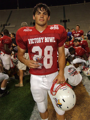 Image: Hico’s Dylan Turner(28) receives the Bob McQueen Defensive M.V.P. Award.