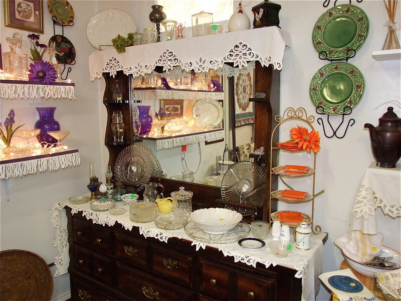Image: Glassware, old lanterns, ornamental hangers and racks and traditional furniture pieces such as this dresser and mirror combination can be found in every corner of the shop ready to be rediscovered.