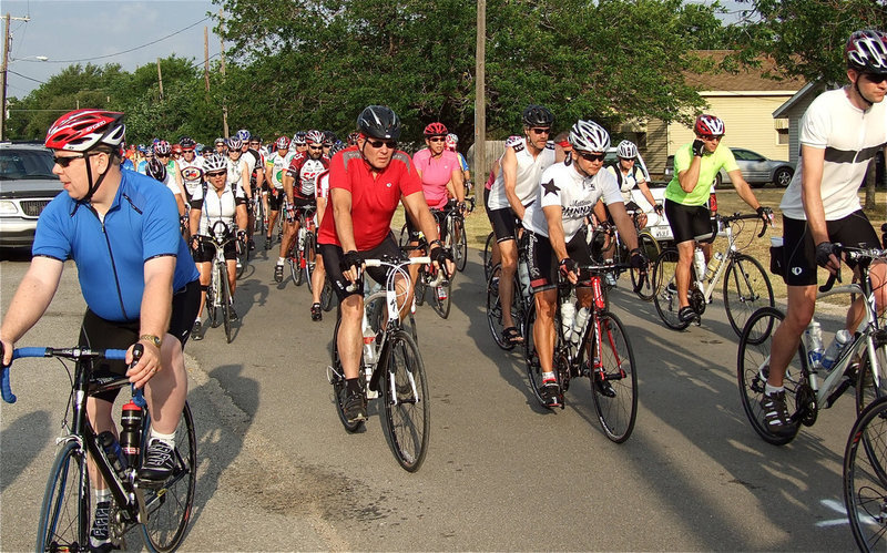Image: The fire truck siren sounds to mark the beginning of the ride. And away they go!