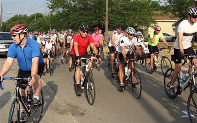 Image: The fire truck siren sounds to mark the beginning of the ride. And away they go!
