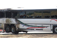 Image: A closer look of the burned and melted bus.
