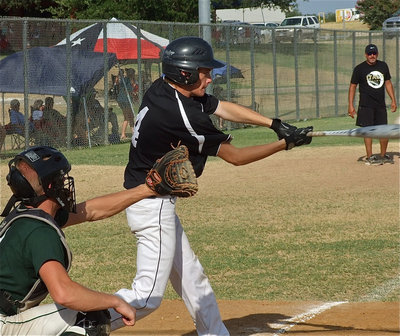 Image: Justin Wood(4) swings one past the Eagles.