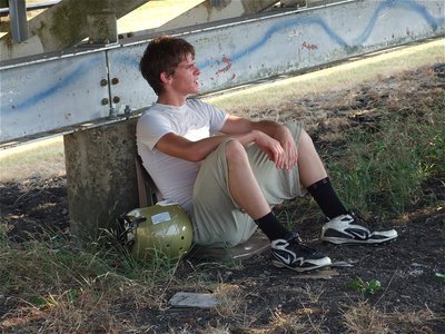 Image: Justin Wood takes a break from the heat.