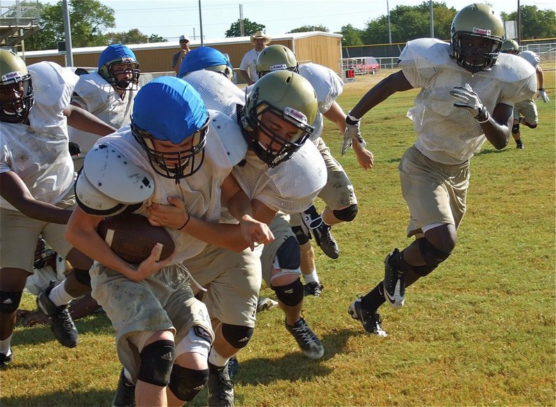 Image: Brandon Souder meets Justin Wood in the backfield.