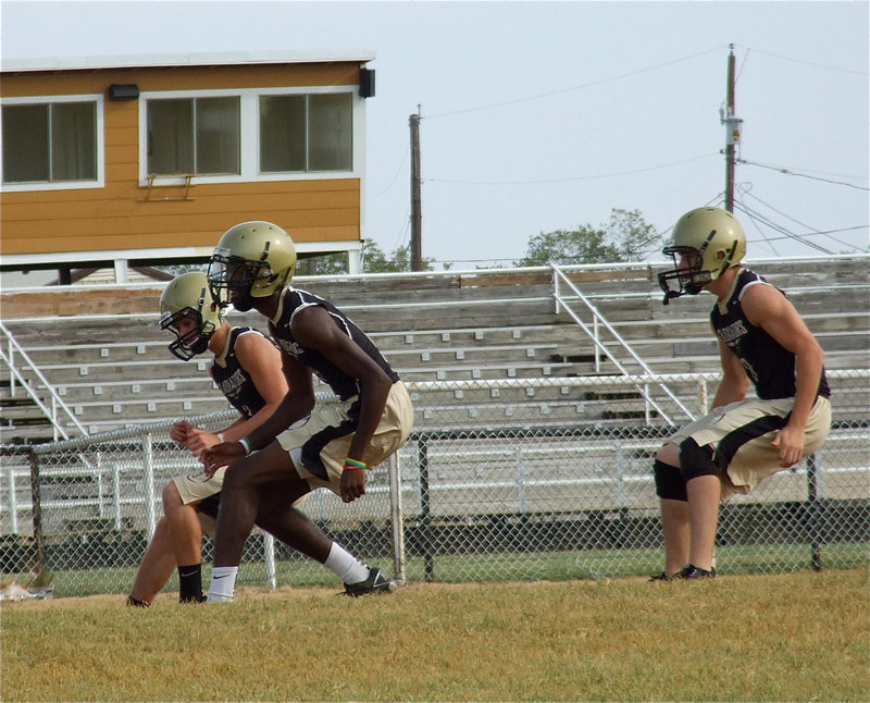 Image: Jase Holden, Devonta Simmons and Hayden Woods work on their footwork.