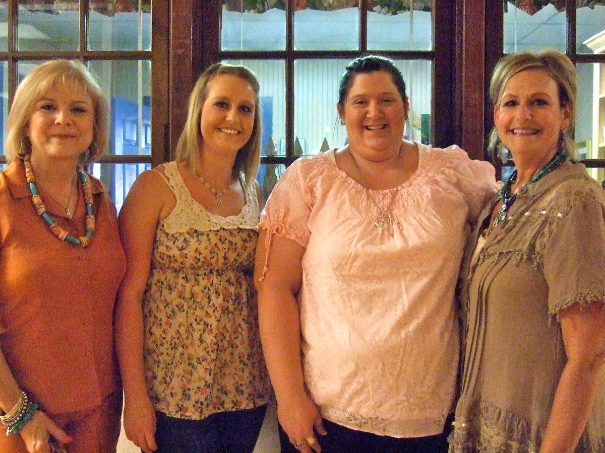 Image: Alice Compton (business manager), Mikalla Wimbish (high school student), Bethany Bland (technology assistant and math assistant) and Denise Wimbish (librarian) all are ready with smiles to meet the new year.