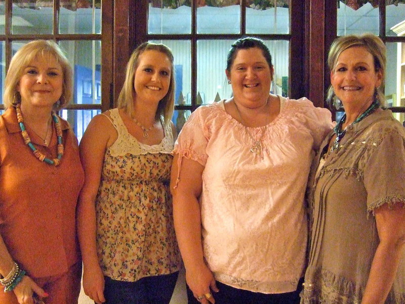Image: Alice Compton (business manager), Mikalla Wimbish (high school student), Bethany Bland (technology assistant and math assistant) and Denise Wimbish (librarian) all are ready with smiles to meet the new year.