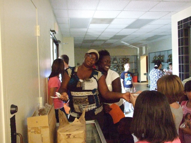 Image: Stephanie Davis helps the students with ice cream of their choice.