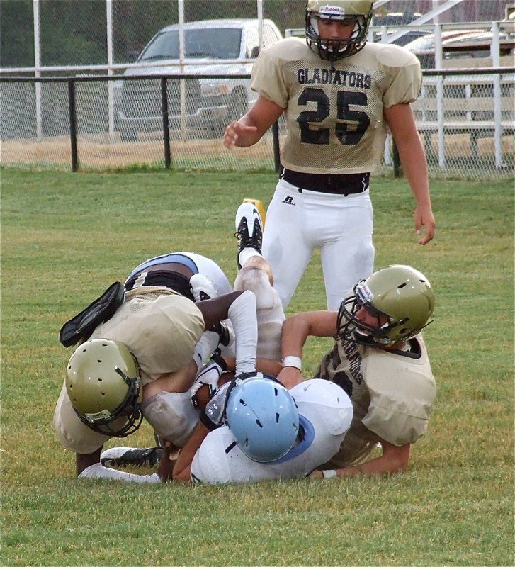 Image: Devonta Simmons and Brandon Souder bring down a Cougar.