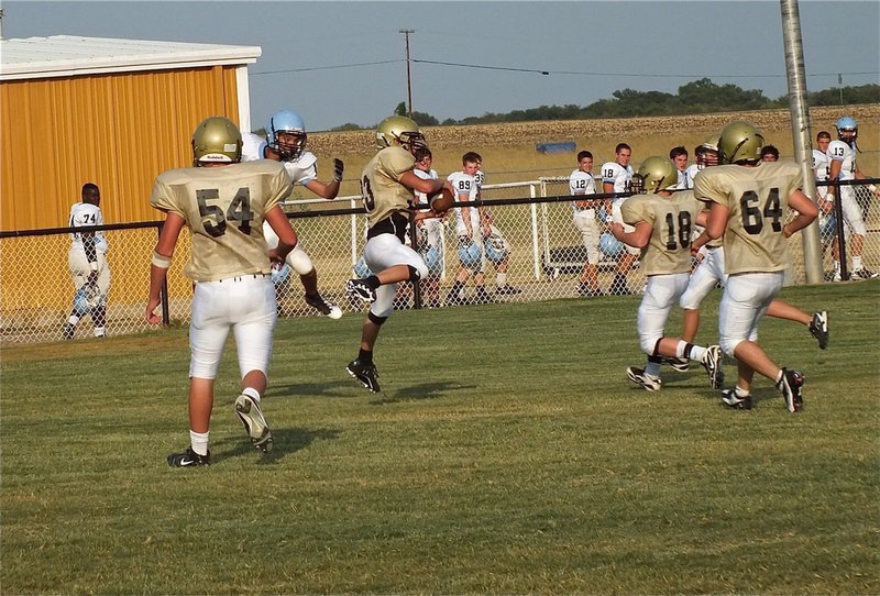 Image: Justin Wood(33) intercepts a Cougar pass during the JV scrimmage.