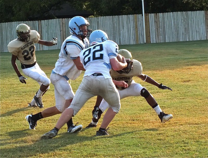 Image: Cornerback, Eric Carson(17), makes an open field tackle.