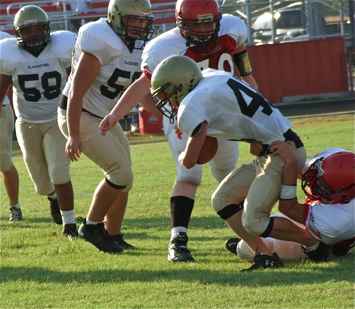 Image: Italy’s Justin Wood(48) fights for extra yards against Maypearl.