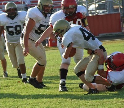 Image: Italy’s Justin Wood(48) fights for extra yards against Maypearl.