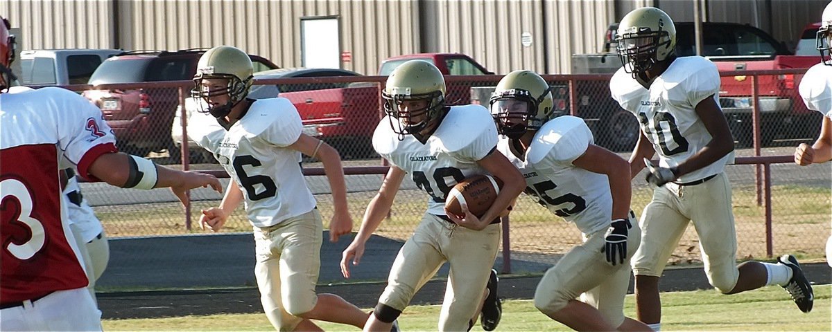 Image: Justin Wood(48) returns the opening kickoff as Cody Boyd(36), Shad Newman(25) and Trevon Robertson(10) look for a Panther to block.