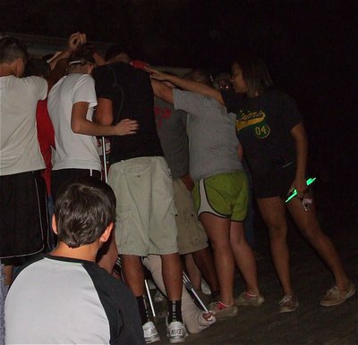 Image: Classmates, teammates and friends surround Brandon and do a chant in his honor.
