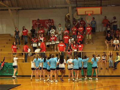 Image: The cheerleaders test the spirit of the band. 