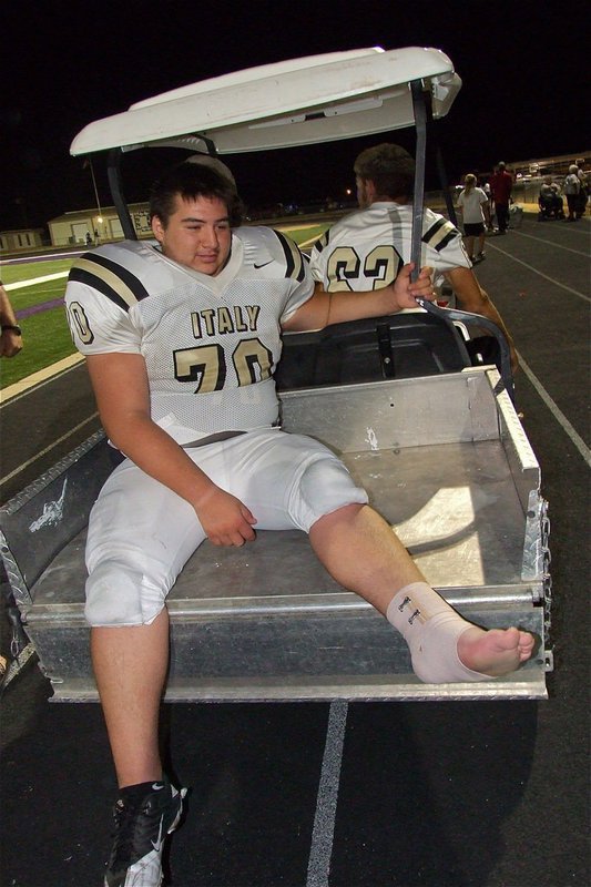 Image: Isaac Medrano(70), who made a couple of big plays in Mart’s backfield from his noseguard position on defense, gets a ride back to the locker room after he rolled his ankle during the contest. 