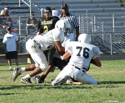 Image: Jaray Anderson(32) and David De La Hoya(76) combine for a tackle in Palmer’s backfield.