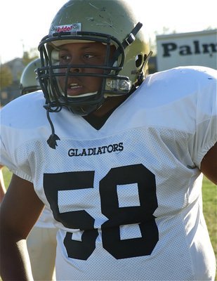 Image: One of the fighting eleven, Darol Mayberry gets ready to take on Palmer in the JV game.