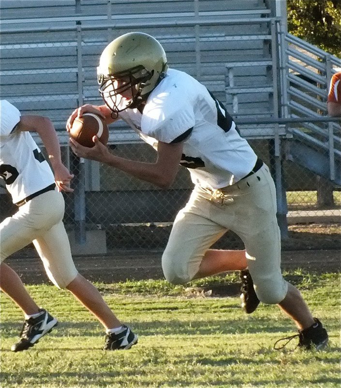 Image: Italy’s Justin Wood(48) takes off on a quarterback keeper.