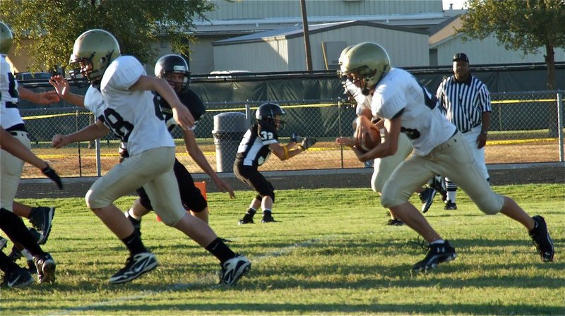 Image: John Escamilla(88) lead blocks for Justin Wood(48).