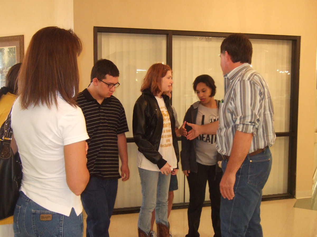 Image: Trinity Mission’s marketing director is greeting the class.