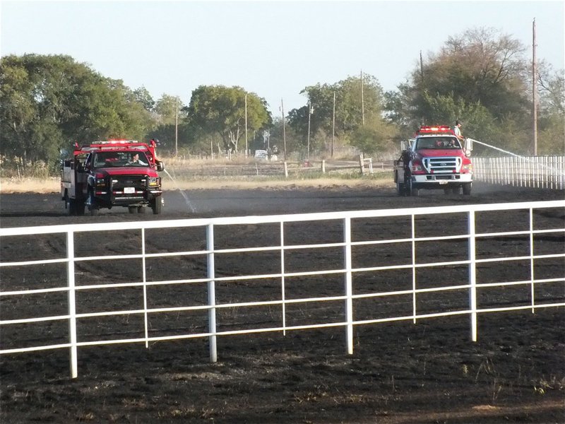 Image: Firefighters work in unison to protect the community.