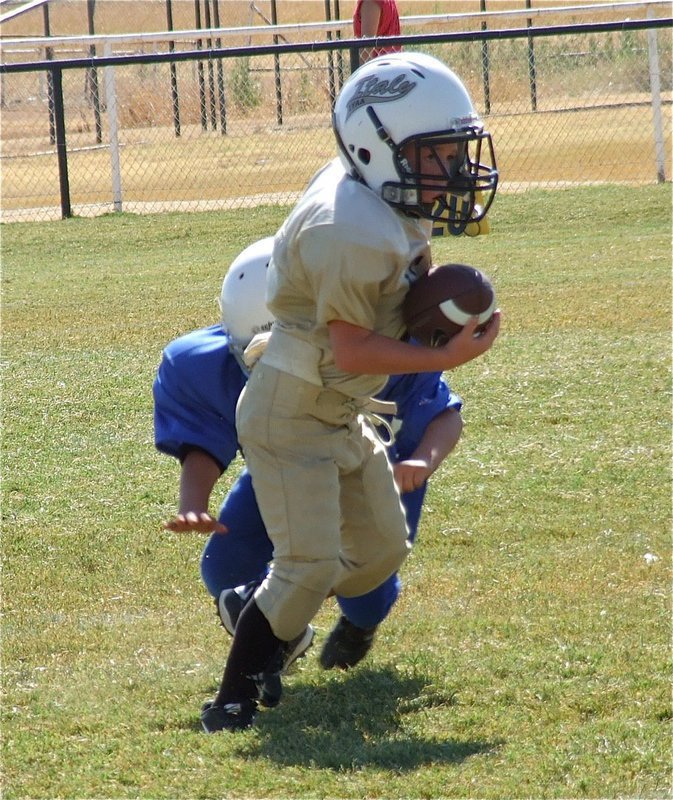 Image: Bryce DeBorde(44) escapes the clutches of a Bulldog tackler and turns on the speed.