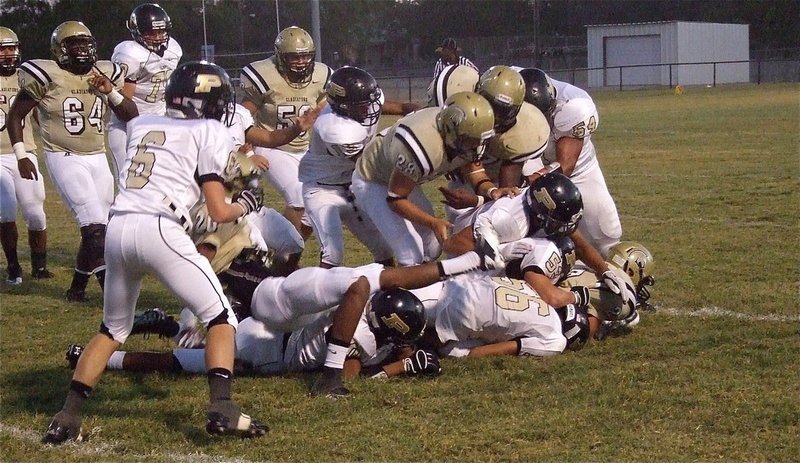 Image: Gladiator Chase Hamilton(2) lays out for extra yards.