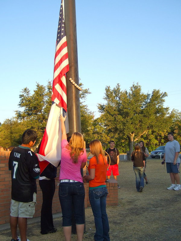 Image: Raising the flag as Taps was being played.